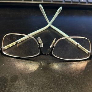 Tiffany brand women eyeglass frames with case.